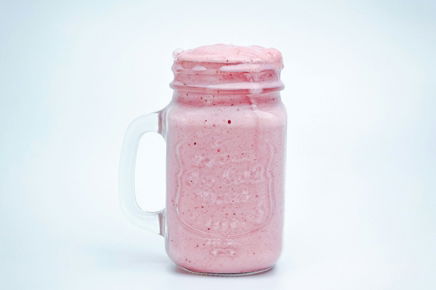 a-pink-drink-in-a-mason-jar-on-a-white-background.jpg a pink drink in a mason jar on a white background