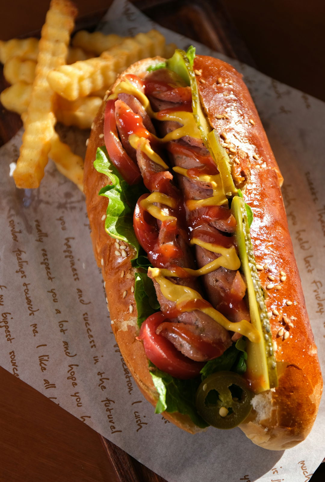 a-hot-dog-on-a-bun-with-ketchup--mustard--and-relish.jpg a hot dog on a bun with ketchup, mustard, and relish